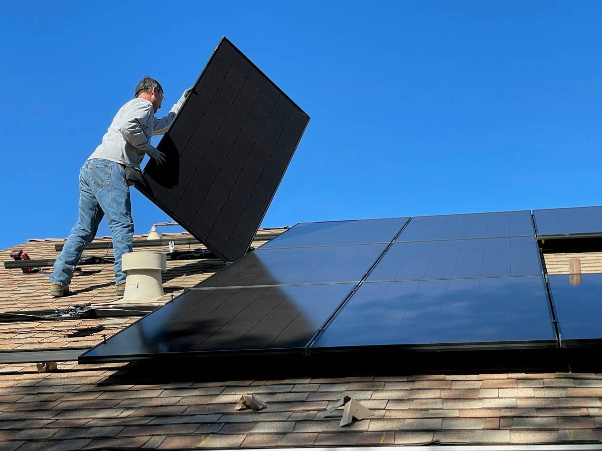 New solar panel technology installed on a modern residential roof with bifacial modules and microinverters