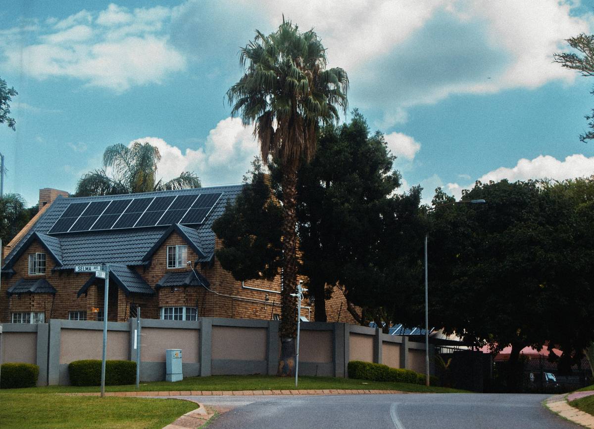 new solar panel tech installed on residential rooftop with dual-glass modules and tracking mounts
